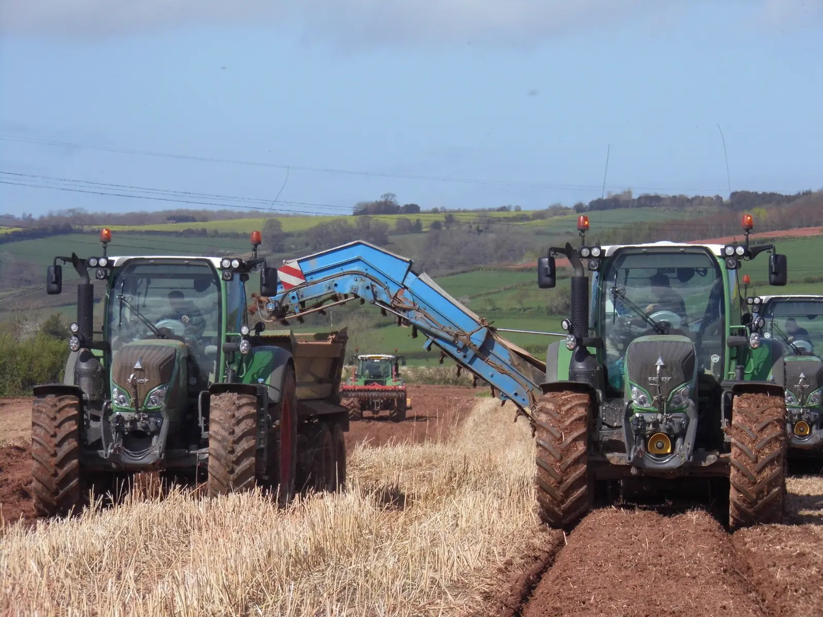 Tractors and planting machinery establishing a Miscanthus crop